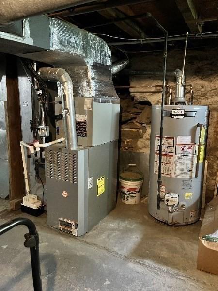 47-49 Dean St, Norton, MA 02766 - utility room with gas water heater and heating unit