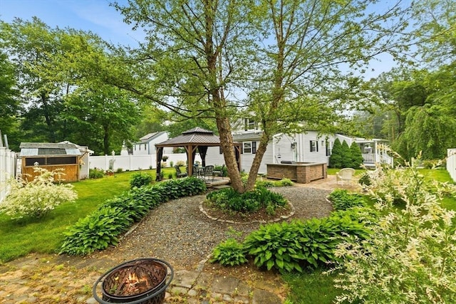 47-49 Dean St, Norton, MA 02766 - fenced backyard featuring a gazebo, a fire pit, a shed, and a patio area