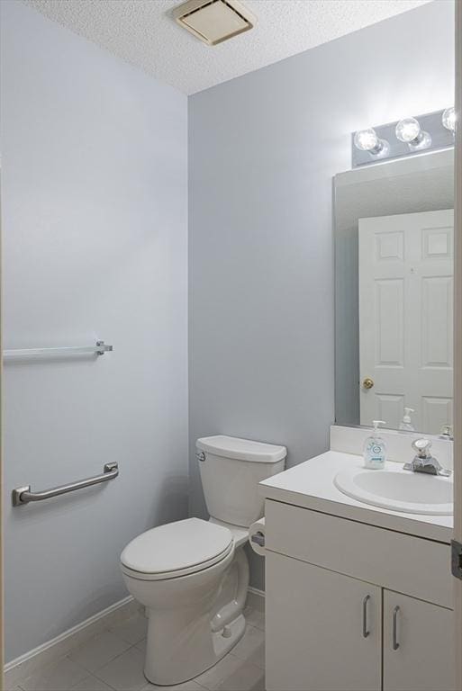 109 Bradford Commons Ln Unit 109, Braintree, MA 02184 - bathroom with vanity, a textured ceiling, and tile patterned floors