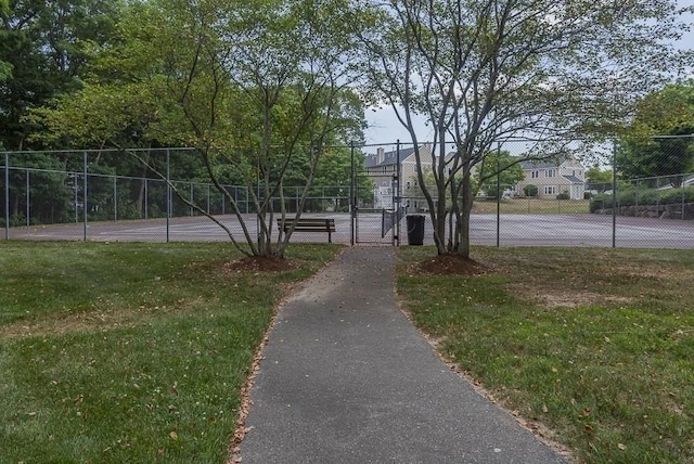 109 Bradford Commons Ln Unit 109, Braintree, MA 02184 - surrounding community with a tennis court and a gate