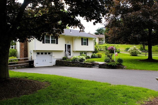 13 Laurana Ln, Hadley, MA 01035 - split foyer home with asphalt driveway and an attached garage