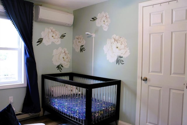 13 Laurana Ln, Hadley, MA 01035 - bedroom featuring an AC wall unit and a nursery area