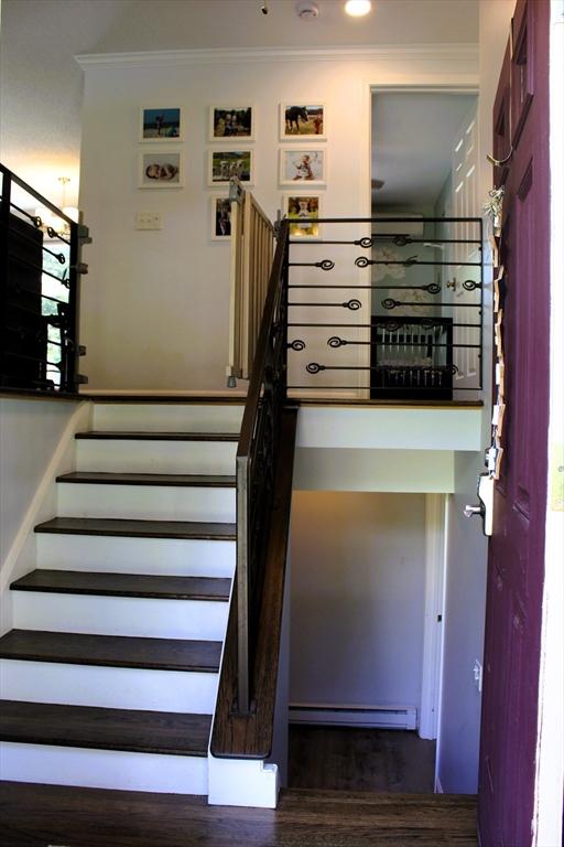 13 Laurana Ln, Hadley, MA 01035 - stairs featuring ornamental molding, wood finished floors, and baseboard heating