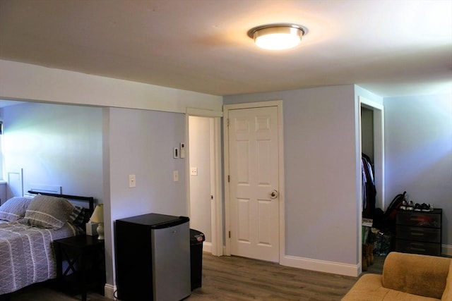 13 Laurana Ln, Hadley, MA 01035 - bedroom featuring freestanding refrigerator, wood finished floors, and baseboards