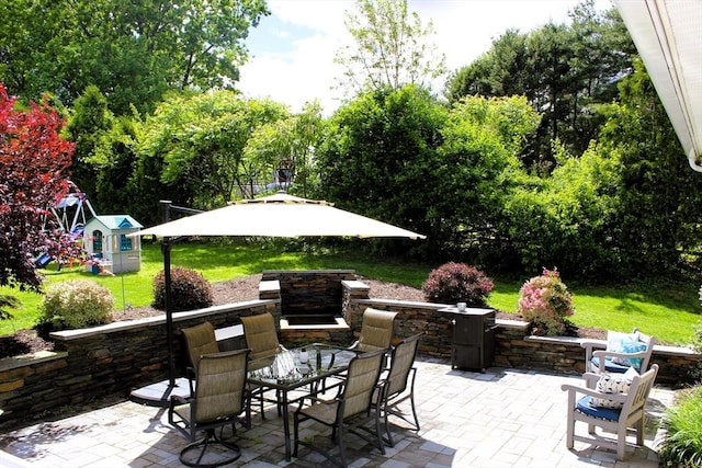 13 Laurana Ln, Hadley, MA 01035 - view of patio / terrace with outdoor dining area and a playground