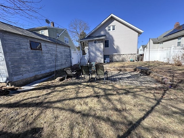 back of house featuring fence