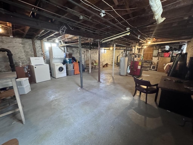 unfinished basement featuring gas water heater and independent washer and dryer