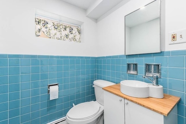 126 Scott Cir, Dedham, MA 02026 - bathroom with vanity, tile walls, toilet, and a wainscoted wall