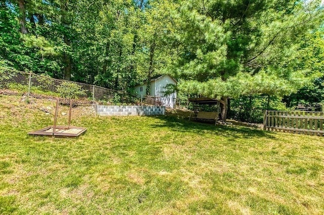 126 Scott Cir, Dedham, MA 02026 - view of yard featuring a garden and an outbuilding