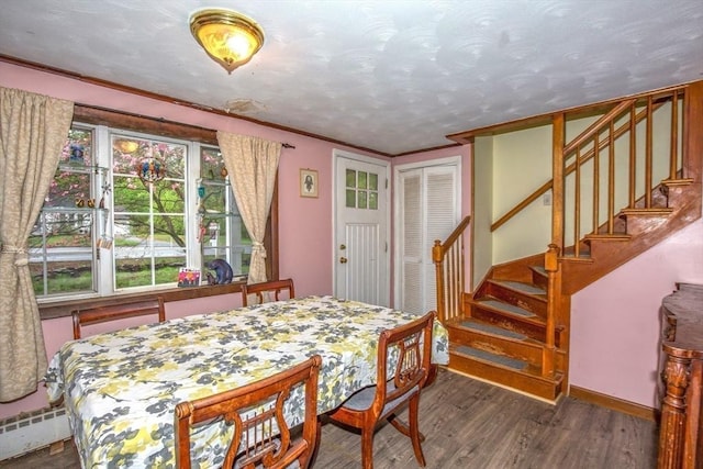 8 N Longyard Rd, Southwick, MA 01077 - dining room with wood finished floors, baseboard heating, stairway, and baseboards