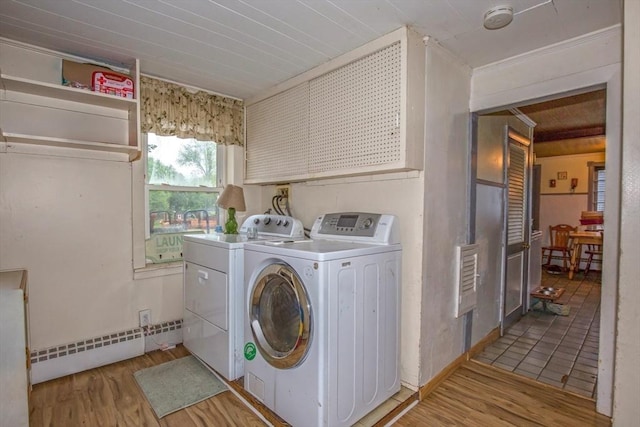 8 N Longyard Rd, Southwick, MA 01077 - laundry area featuring a baseboard radiator, washing machine and dryer, and light wood-type flooring