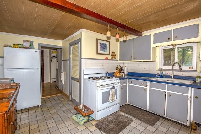 8 N Longyard Rd, Southwick, MA 01077 - kitchen with white appliances, a sink, wooden ceiling, dark countertops, and tile patterned flooring