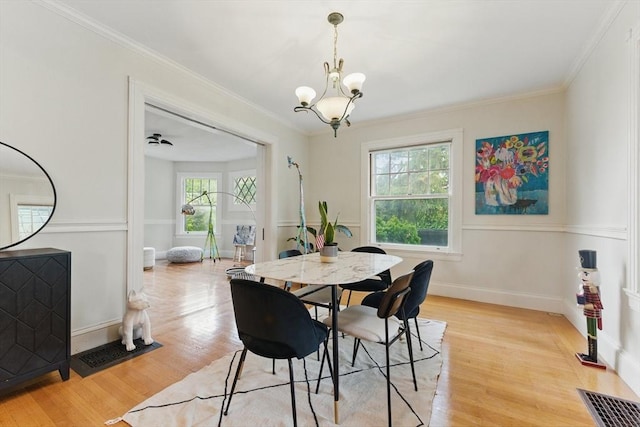 18 Alden St, Newton, MA 02459 - dining room with a chandelier, light wood-type flooring, and ornamental molding