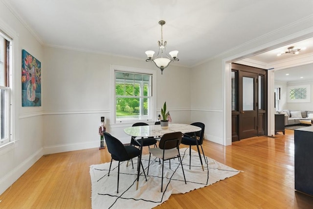 18 Alden St, Newton, MA 02459 - dining space featuring a chandelier, light wood-type flooring, and ornamental molding