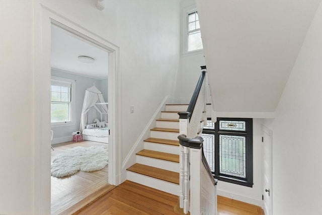 18 Alden St, Newton, MA 02459 - staircase with wood finished floors and baseboards