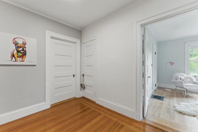 18 Alden St, Newton, MA 02459 - hallway featuring wood finished floors and crown molding