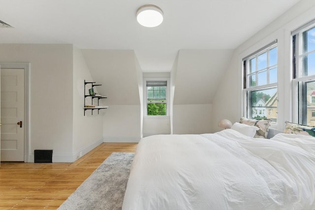 18 Alden St, Newton, MA 02459 - bedroom with light wood-style flooring and multiple windows