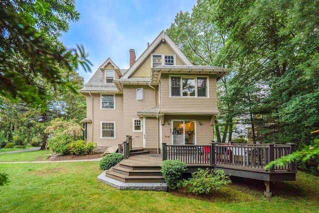 18 Alden St, Newton, MA 02459 - view of front of property with a chimney, a front lawn, and a deck