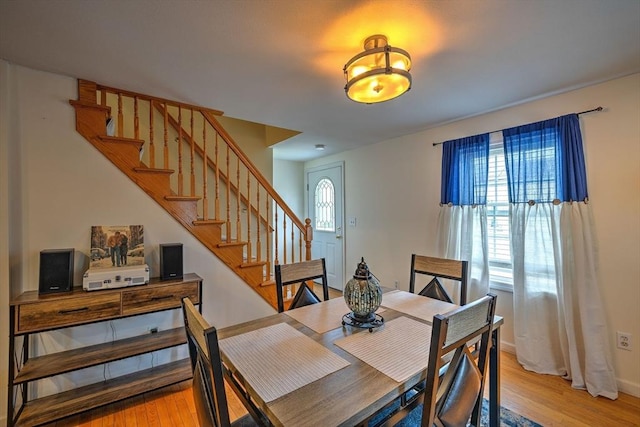 143 Eagle St, Ware, MA 01082 - dining space featuring baseboards, stairway, and light wood-type flooring