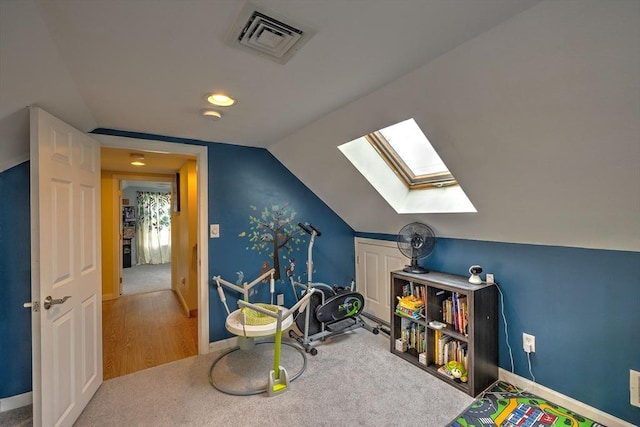 143 Eagle St, Ware, MA 01082 - game room featuring lofted ceiling with skylight, visible vents, carpet, and baseboards