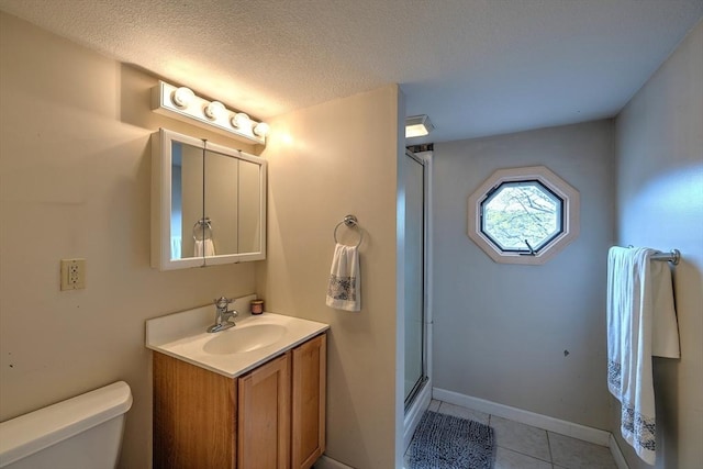143 Eagle St, Ware, MA 01082 - full bath featuring a textured ceiling, a stall shower, toilet, tile patterned floors, and vanity