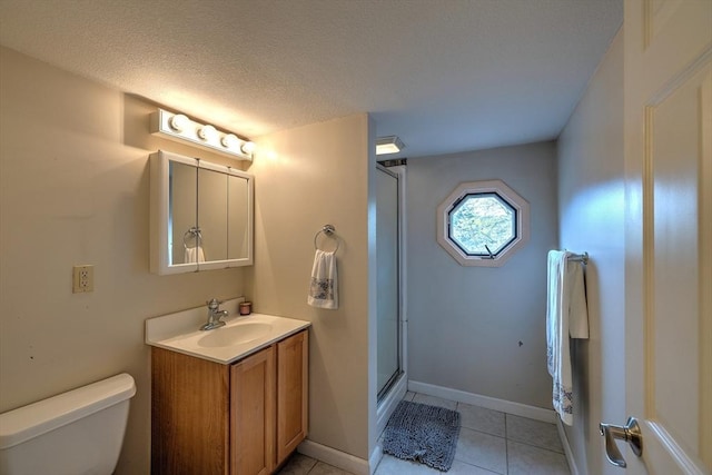 143 Eagle St, Ware, MA 01082 - full bath with vanity, toilet, a stall shower, baseboards, and tile patterned flooring