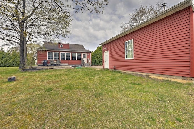 143 Eagle St, Ware, MA 01082 - rear view of property with a yard and entry steps