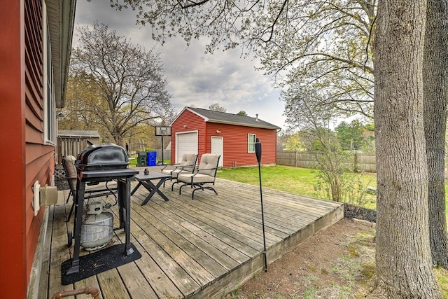 143 Eagle St, Ware, MA 01082 - wooden terrace with a fenced backyard, a yard, an outbuilding, area for grilling, and a detached garage
