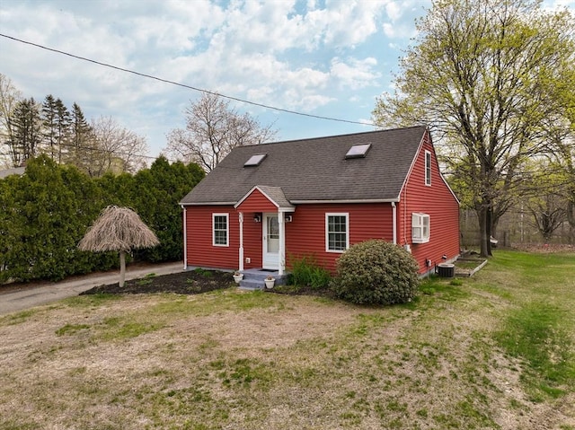 143 Eagle St, Ware, MA 01082 - view of front of house featuring a front yard, a shingled roof, and central AC