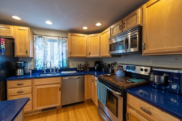 143 Eagle St, Ware, MA 01082 - kitchen with recessed lighting, appliances with stainless steel finishes, light wood finished floors, a sink, and visible vents