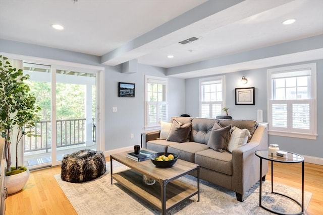 606 W Falmouth Hwy Unit 7, Falmouth, MA 02540 - living room featuring baseboards, light wood-style floors, visible vents, and plenty of natural light