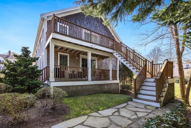 606 W Falmouth Hwy Unit 7, Falmouth, MA 02540 - rear view of house featuring a deck and stairs