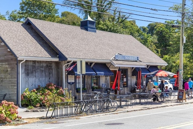 606 W Falmouth Hwy Unit 7, Falmouth, MA 02540 - exterior space with a chimney and roof with shingles