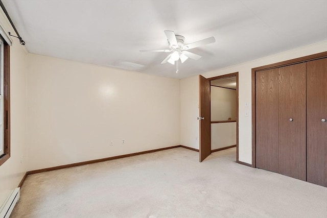 24 Mountainshire Dr Unit 24, Worcester, MA 01606 - unfurnished bedroom featuring baseboard heating, light colored carpet, baseboards, ceiling fan, and a closet