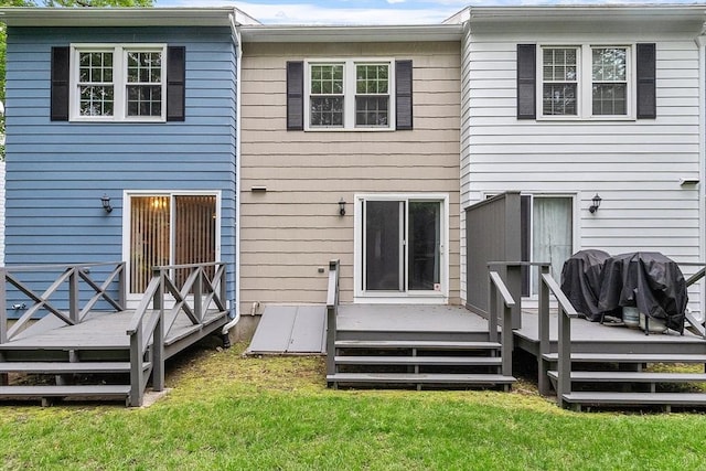 24 Mountainshire Dr Unit 24, Worcester, MA 01606 - rear view of property featuring a deck and a lawn