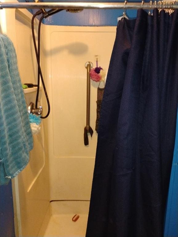 bathroom with a shower with shower curtain