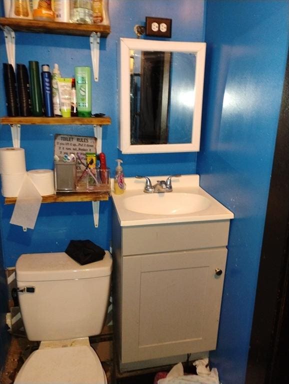 bathroom with toilet and vanity