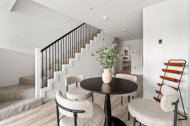 602 Canterbury Unit 5, Boston, MA 02131 - dining space featuring stairs and light wood-type flooring