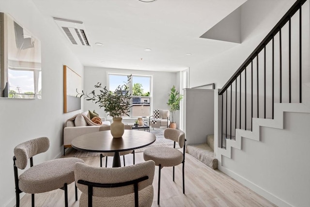 602 Canterbury Unit 5, Boston, MA 02131 - dining space with light wood-type flooring and stairway