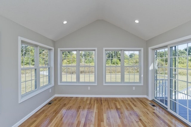 unfurnished sunroom with a healthy amount of sunlight and visible vents