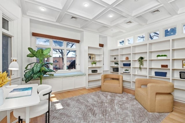 sitting room with coffered ceiling, visible vents, beamed ceiling, and light wood-style flooring