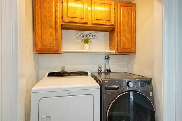 13 Woodland Dr, Hudson, MA 01749 - laundry room featuring separate washer and dryer and cabinet space