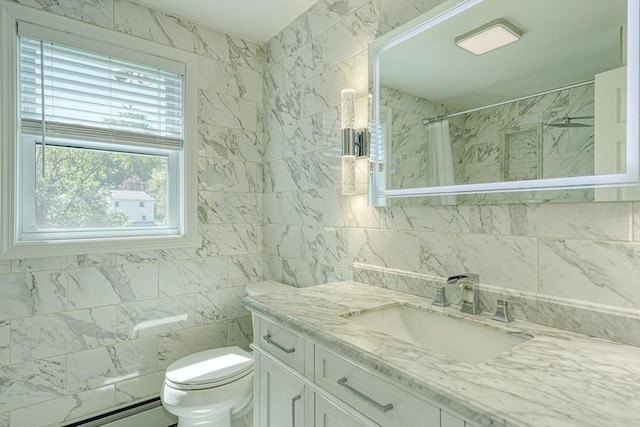 13 Woodland Dr, Hudson, MA 01749 - full bath with tile walls, plenty of natural light, a baseboard radiator, toilet, and vanity