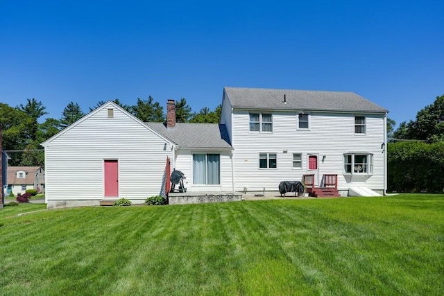 13 Woodland Dr, Hudson, MA 01749 - rear view of property featuring a yard and a chimney