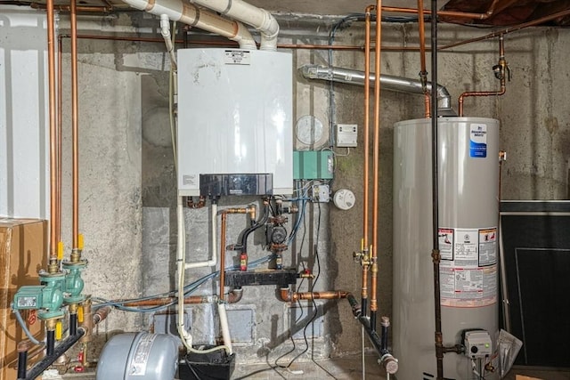 13 Woodland Dr, Hudson, MA 01749 - utility room featuring gas water heater and tankless water heater