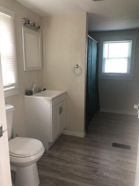31 Benham St, Orange, MA 01364 - full bath featuring wood finished floors, vanity, and a shower with curtain