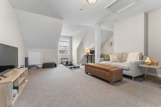 carpeted living room featuring vaulted ceiling