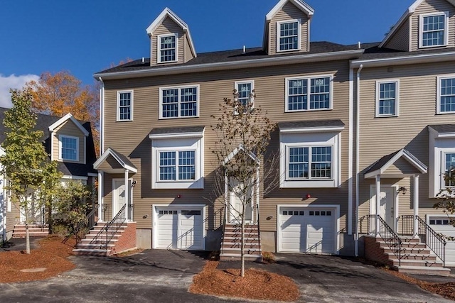 townhome / multi-family property featuring a garage