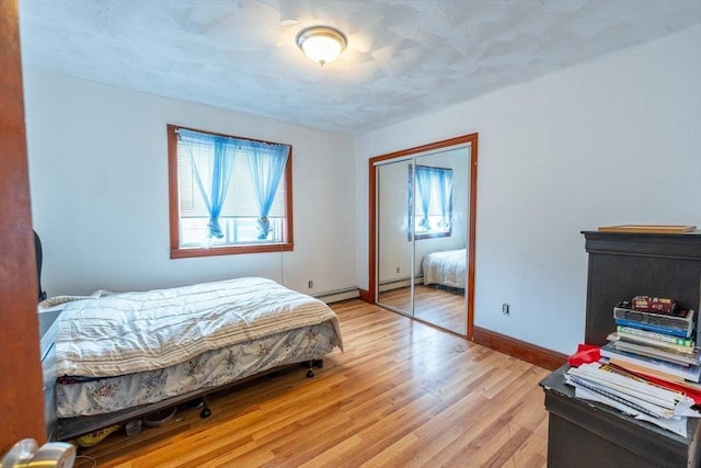 12 Charles St, Brockton, MA 02301 - bedroom featuring multiple windows, light wood-style flooring, a closet, and baseboards