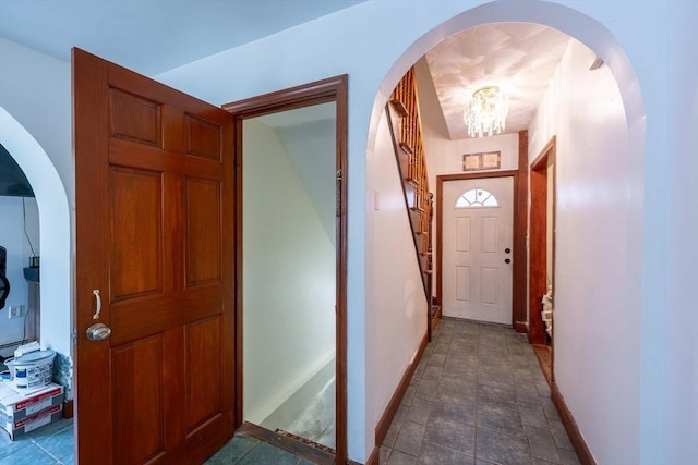 12 Charles St, Brockton, MA 02301 - hall with baseboards, a chandelier, and stone finish floors